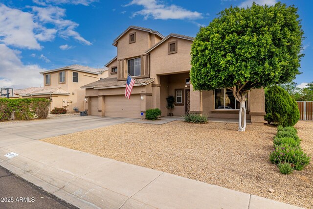 6971 W El Cortez Pl, Peoria, AZ 85383 - view of front of home with a garage, stucco siding, driveway, and a tile roof
