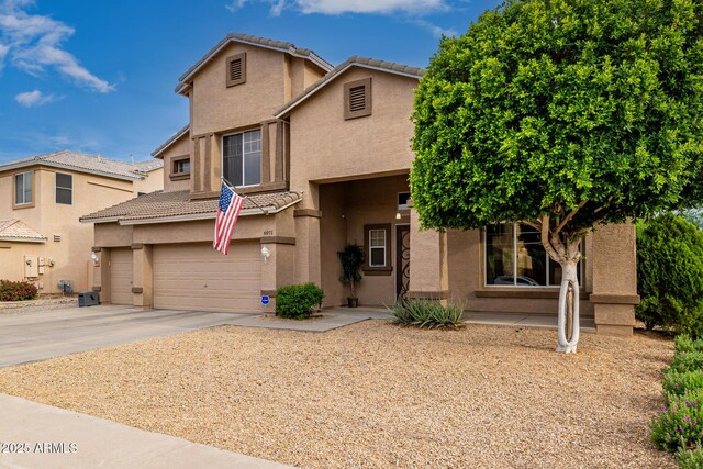 6971 W El Cortez Pl, Peoria, AZ 85383 - view of front facade featuring stucco siding, a tile roof, a garage, and concrete driveway