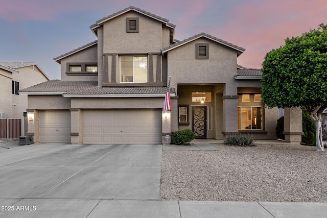 6971 W El Cortez Pl, Peoria, AZ 85383 - view of front of house featuring stucco siding, concrete driveway, a tiled roof, and an attached garage