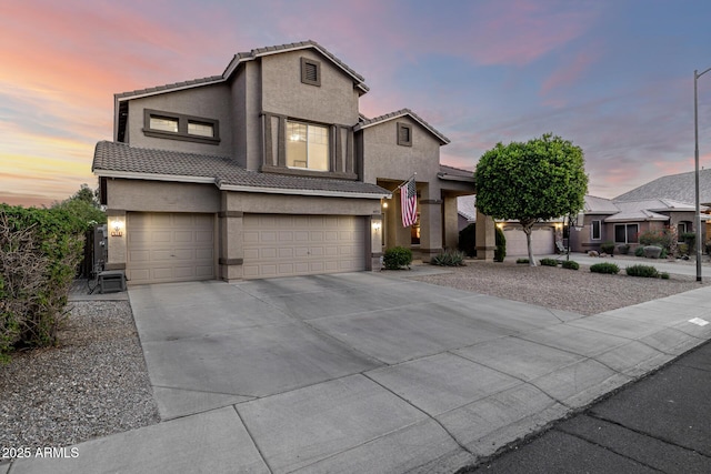 6971 W El Cortez Pl, Peoria, AZ 85383 - view of front facade with stucco siding, a garage, a tile roof, and concrete driveway