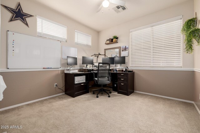 6971 W El Cortez Pl, Peoria, AZ 85383 - home office with light carpet, a ceiling fan, and baseboards
