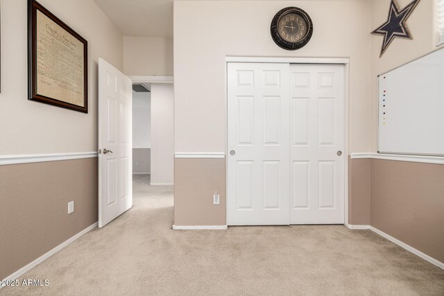 6971 W El Cortez Pl, Peoria, AZ 85383 - unfurnished bedroom featuring carpet, a closet, and baseboards