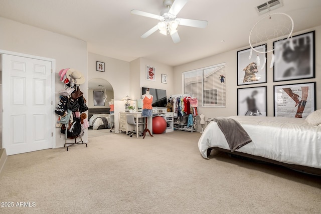 6971 W El Cortez Pl, Peoria, AZ 85383 - carpeted bedroom featuring arched walkways and a ceiling fan
