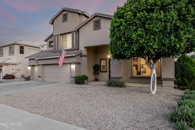 6971 W El Cortez Pl, Peoria, AZ 85383 - traditional home with stucco siding, an attached garage, concrete driveway, and a tiled roof