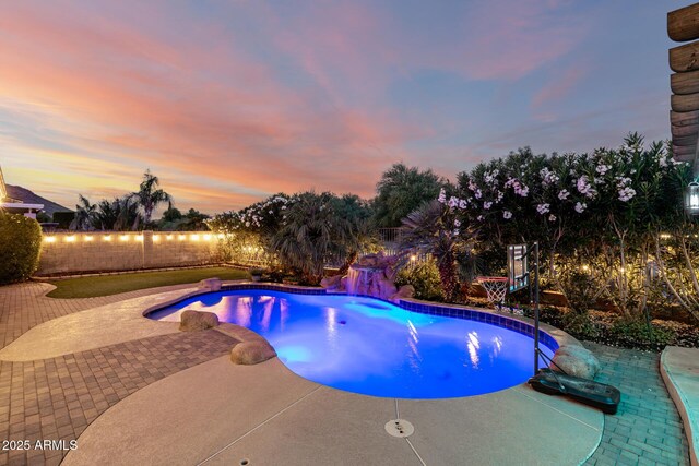 6971 W El Cortez Pl, Peoria, AZ 85383 - view of swimming pool featuring a fenced backyard and a patio