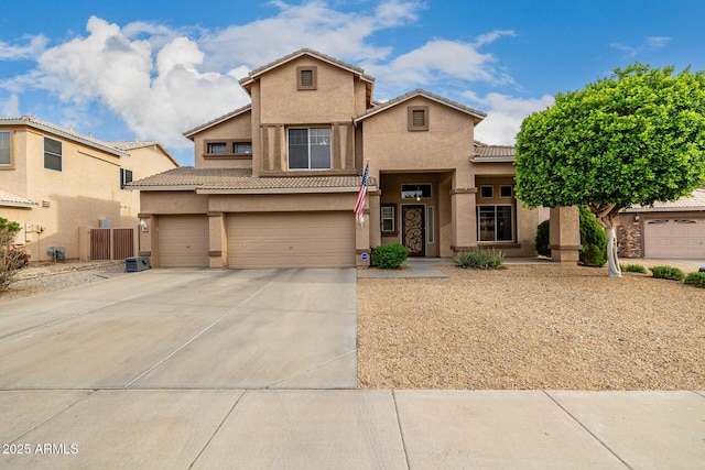 6971 W El Cortez Pl, Peoria, AZ 85383 - view of front of property with stucco siding, a tiled roof, an attached garage, and driveway