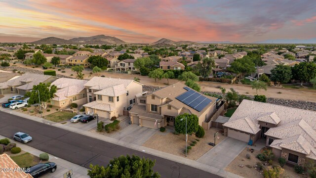6971 W El Cortez Pl, Peoria, AZ 85383 - aerial view at dusk of a residential view and a mountain view