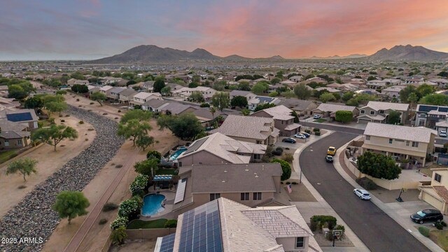 6971 W El Cortez Pl, Peoria, AZ 85383 - aerial overview of property's location with a mountainous background and nearby suburban area