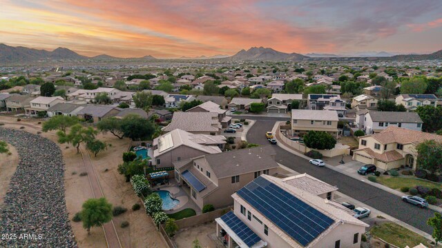 6971 W El Cortez Pl, Peoria, AZ 85383 - aerial view at dusk of a residential view and a mountain view