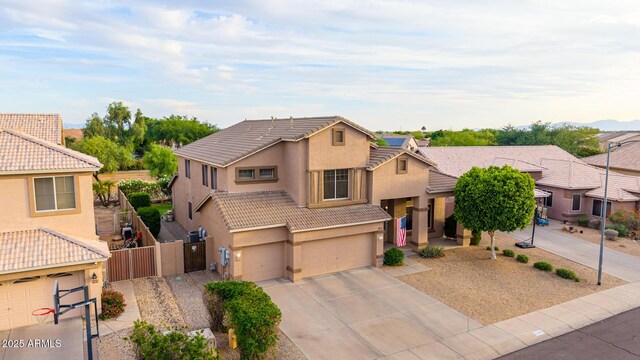 6971 W El Cortez Pl, Peoria, AZ 85383 - view of front of house with stucco siding, a tiled roof, a garage, a gate, and concrete driveway