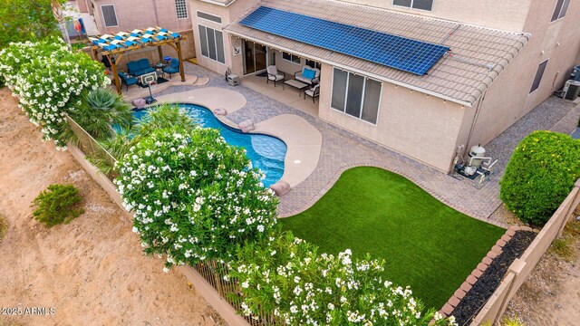 6971 W El Cortez Pl, Peoria, AZ 85383 - view of swimming pool featuring a fenced backyard, a patio area, and an outdoor hangout area