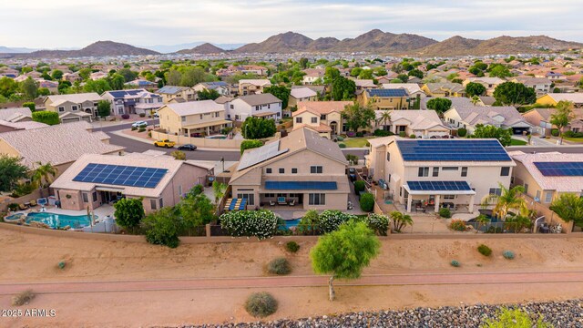 6971 W El Cortez Pl, Peoria, AZ 85383 - aerial view of residential area with a mountainous background and a pool area