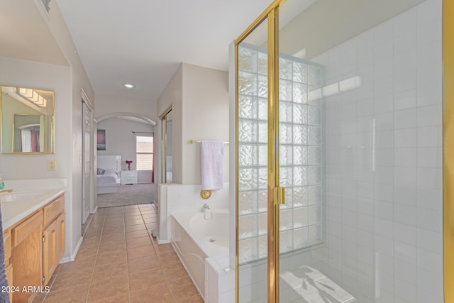 bathroom with vanity, separate shower and tub, and tile patterned flooring