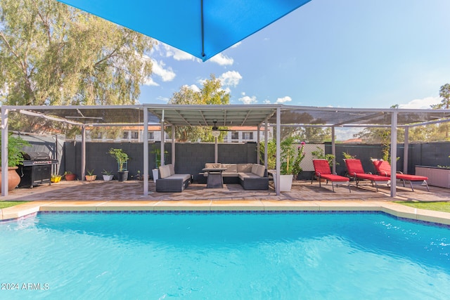 view of swimming pool with an outdoor living space, a patio area, glass enclosure, and area for grilling