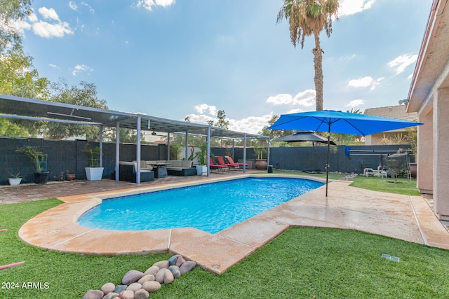 view of pool featuring a lanai, an outdoor living space, a yard, and a patio