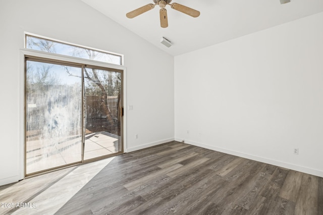 empty room featuring wood finished floors, ceiling fan, baseboards, and lofted ceiling