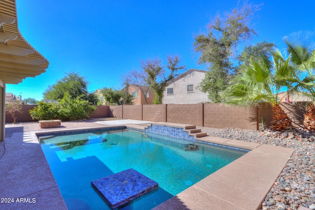 view of pool featuring a hot tub and a patio area