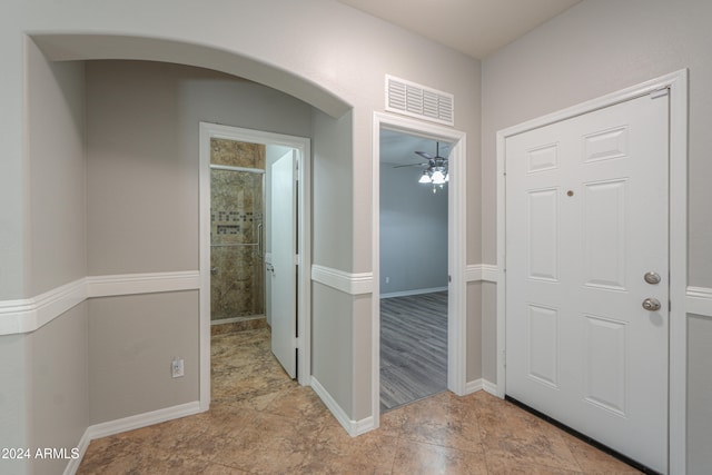 foyer with ceiling fan