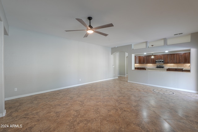 unfurnished living room featuring ceiling fan