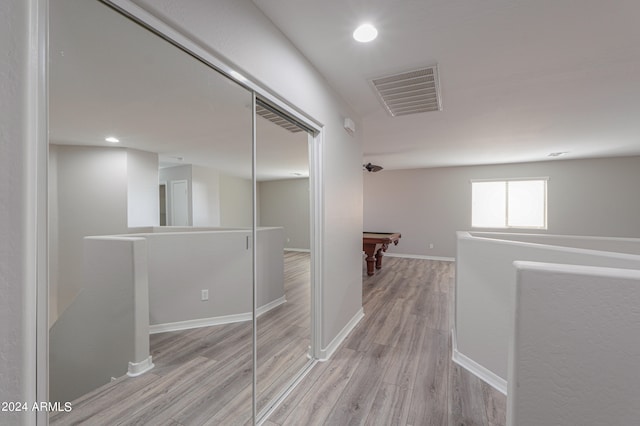 hallway featuring light hardwood / wood-style flooring