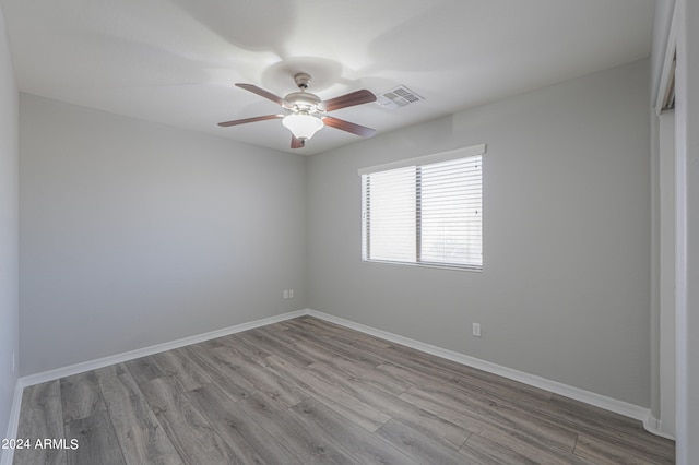 unfurnished room featuring ceiling fan and light hardwood / wood-style floors