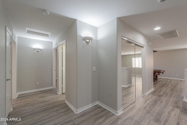 hallway with light wood-type flooring