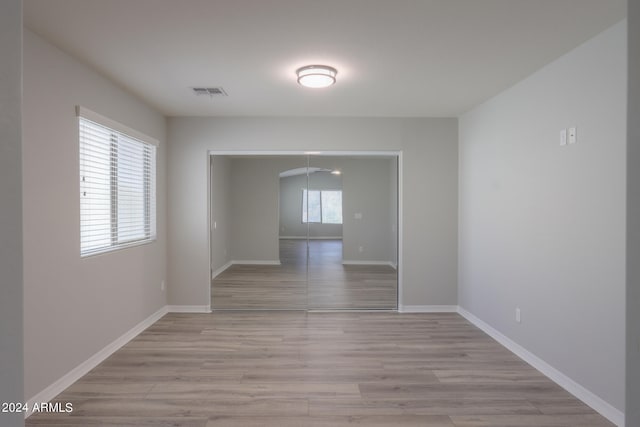 unfurnished room with light hardwood / wood-style flooring