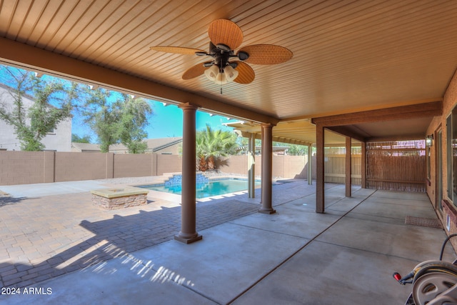 view of patio / terrace with ceiling fan and a fenced in pool