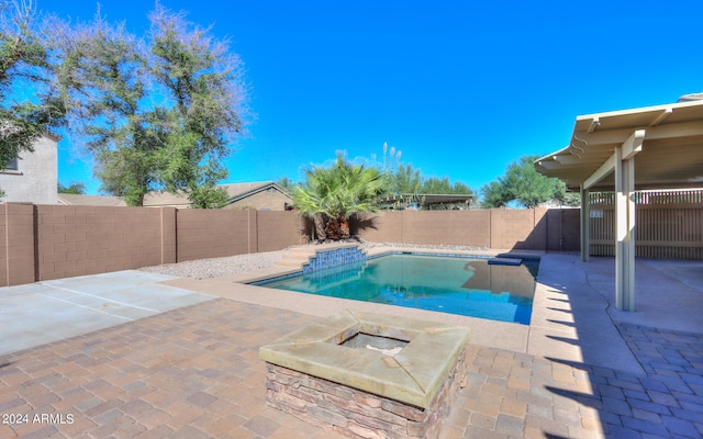 view of swimming pool featuring a patio area