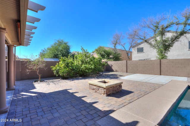 view of patio / terrace with an outdoor fire pit