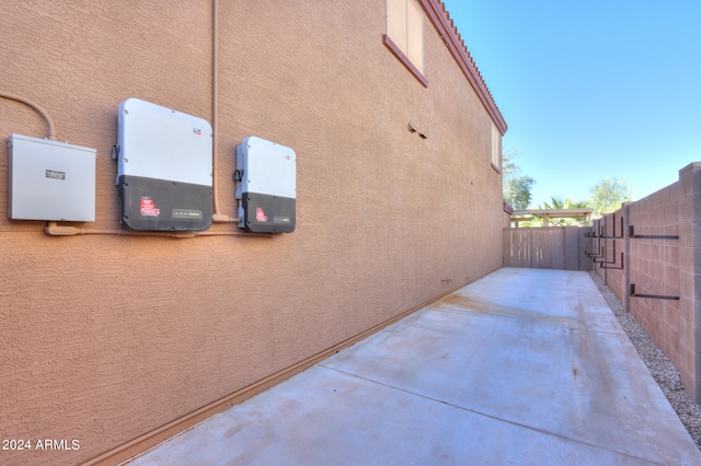 view of side of property with a patio area