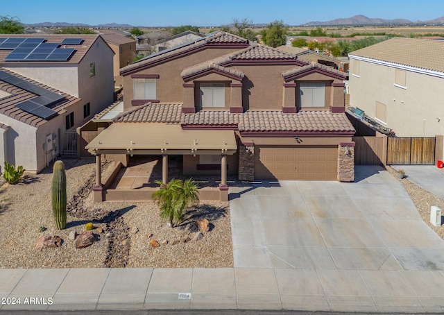 view of front of house with a mountain view and a garage