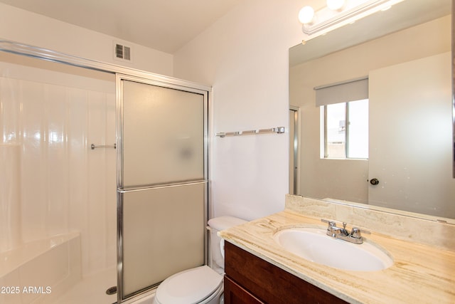 full bath with visible vents, a shower stall, toilet, and vanity