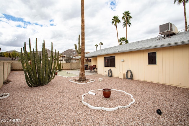 view of yard featuring cooling unit, a patio area, and a fenced backyard