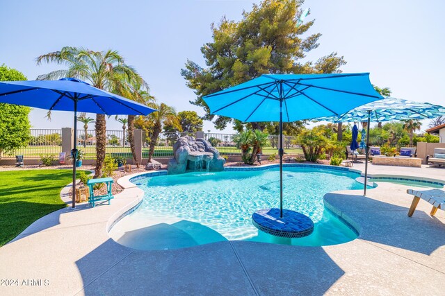 view of swimming pool featuring a patio