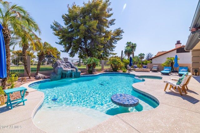 view of swimming pool with a patio