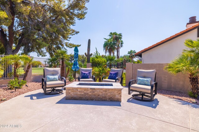 view of patio / terrace featuring a fire pit