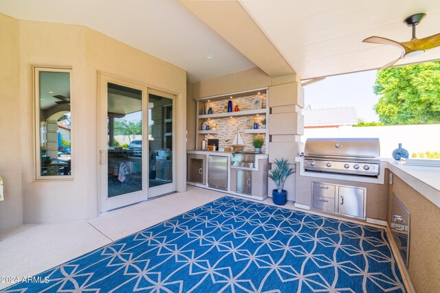 view of patio / terrace with ceiling fan, grilling area, and an outdoor kitchen