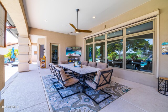 interior space with ceiling fan