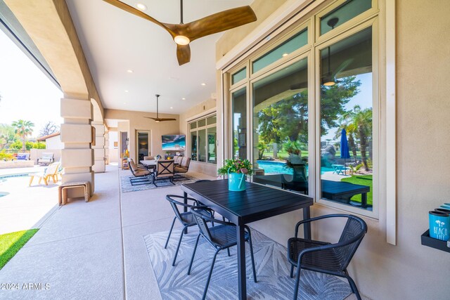 view of patio featuring ceiling fan and french doors