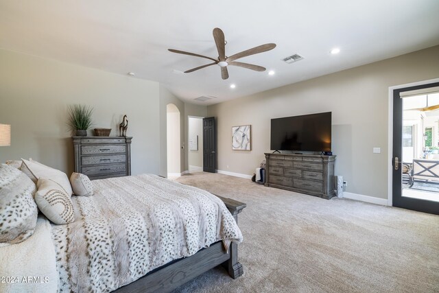 carpeted bedroom featuring ceiling fan and access to exterior