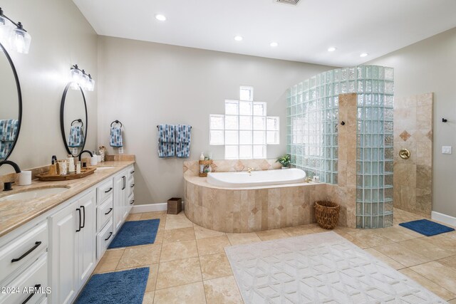 bathroom featuring vanity, plus walk in shower, and tile patterned floors