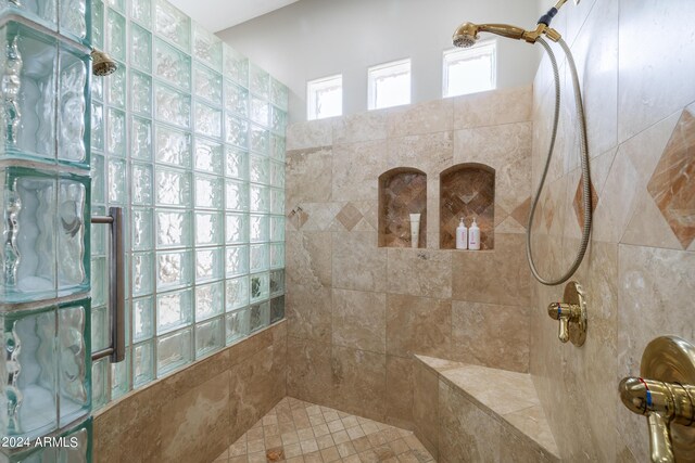 bathroom featuring tiled shower