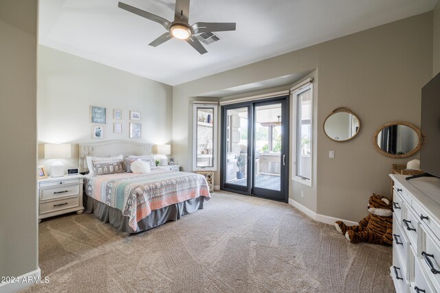 carpeted bedroom with access to exterior and ceiling fan