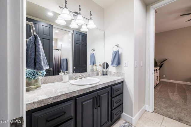 bathroom featuring tile patterned flooring and vanity