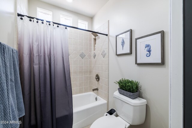 bathroom featuring toilet and shower / bath combo