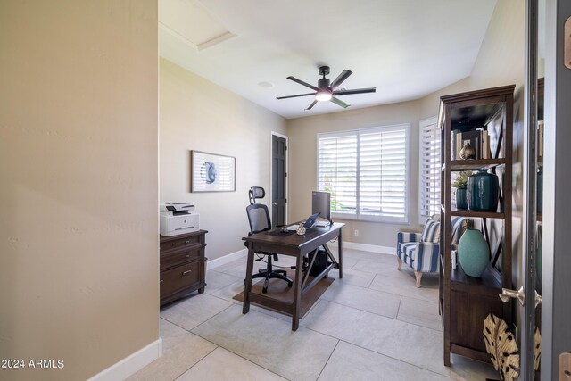 office featuring ceiling fan and light tile patterned floors