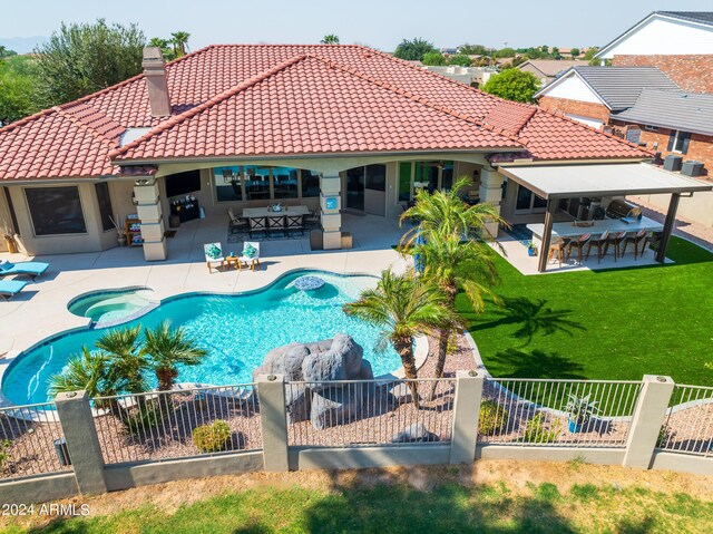 view of swimming pool featuring outdoor lounge area, a yard, and a patio