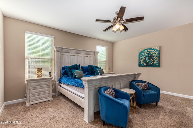 bedroom with ceiling fan and light carpet