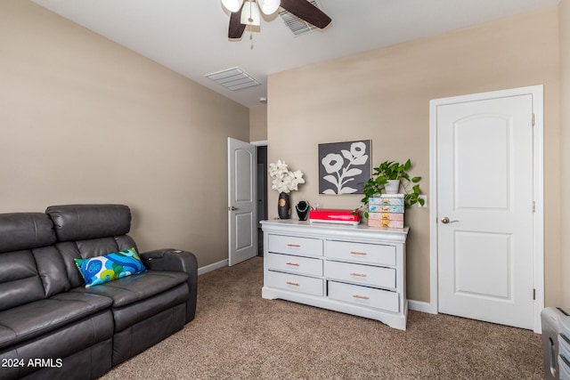 living area with ceiling fan and light colored carpet